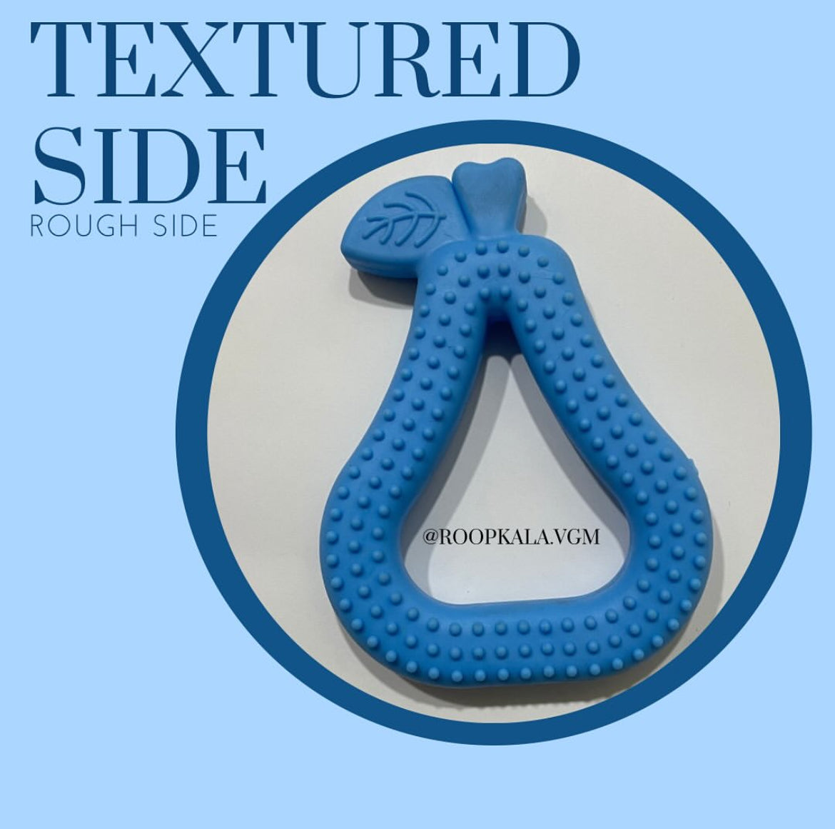 A dual-sided baby teether featuring one textured side and one smooth side.